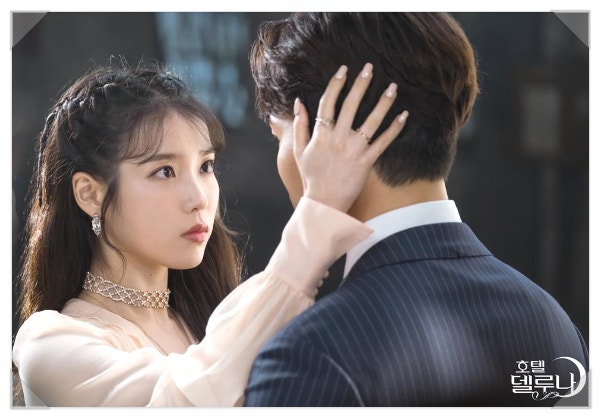 IU in Hotel Del Luna wearing a Korean designer’s crystal earrings, styled with a choker necklace and soft pastel dress